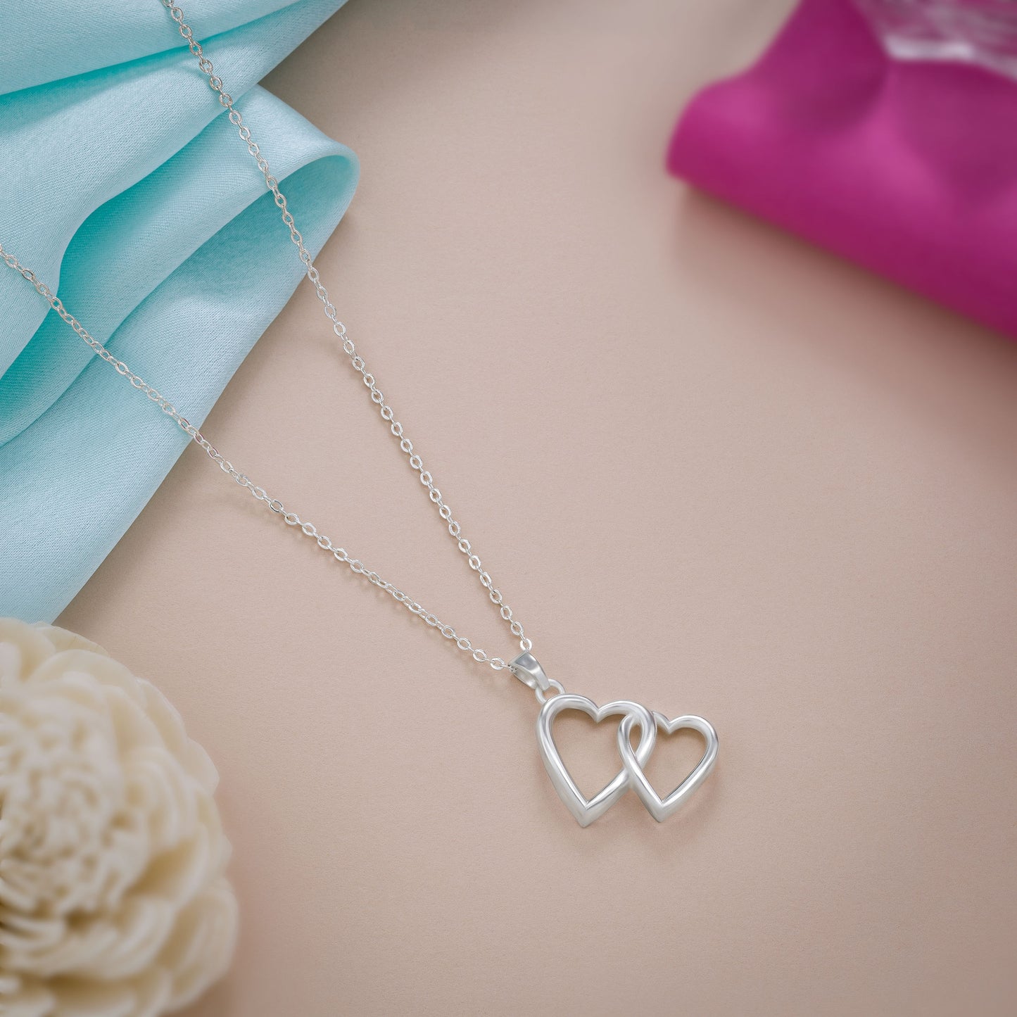 silver heart pendant with a chain