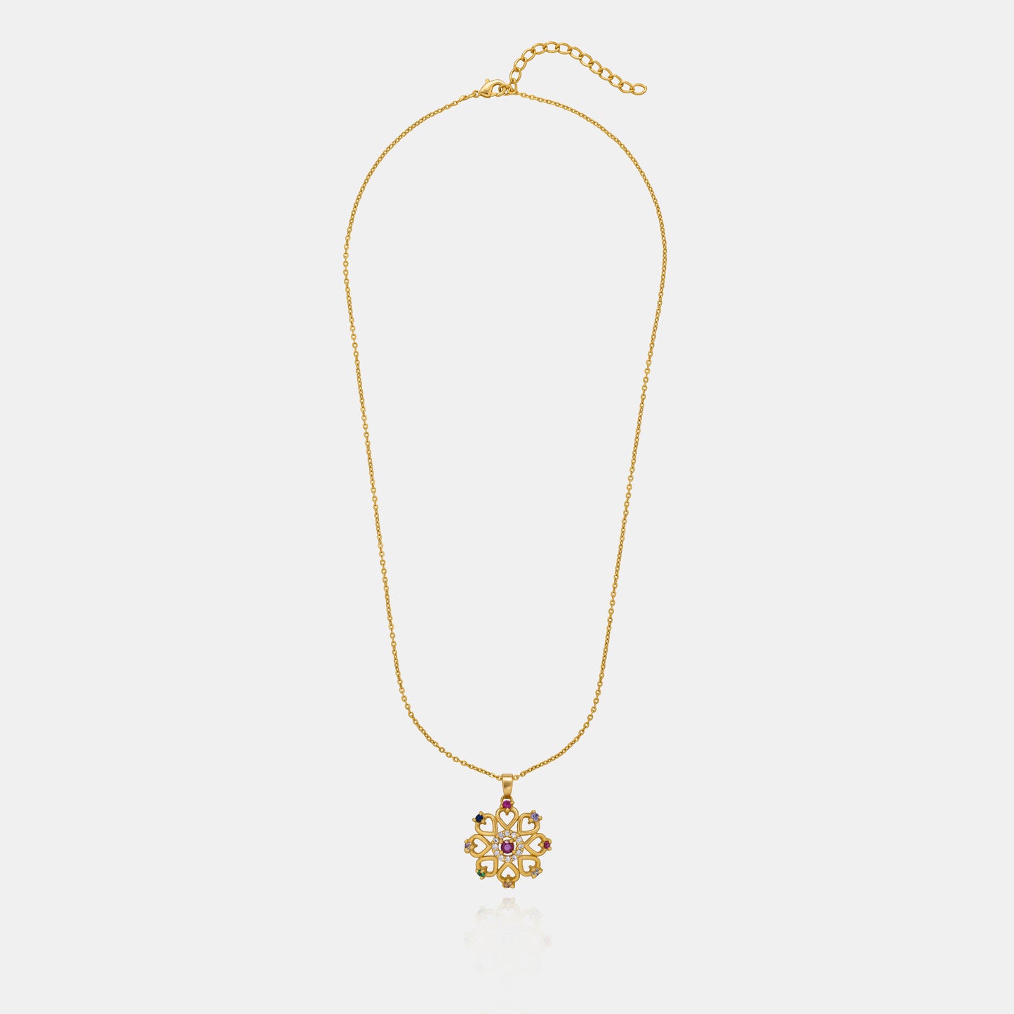 golden necklace with a flower design and multi colored stones