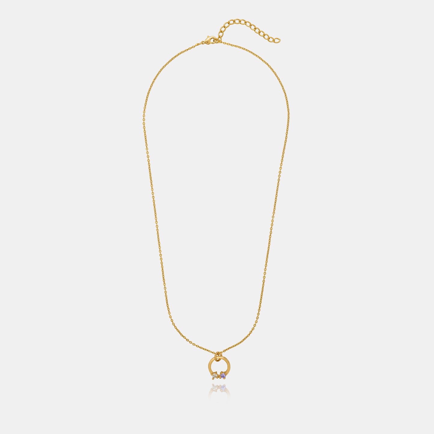 stylish golden necklace featuring circle pendant with white stone