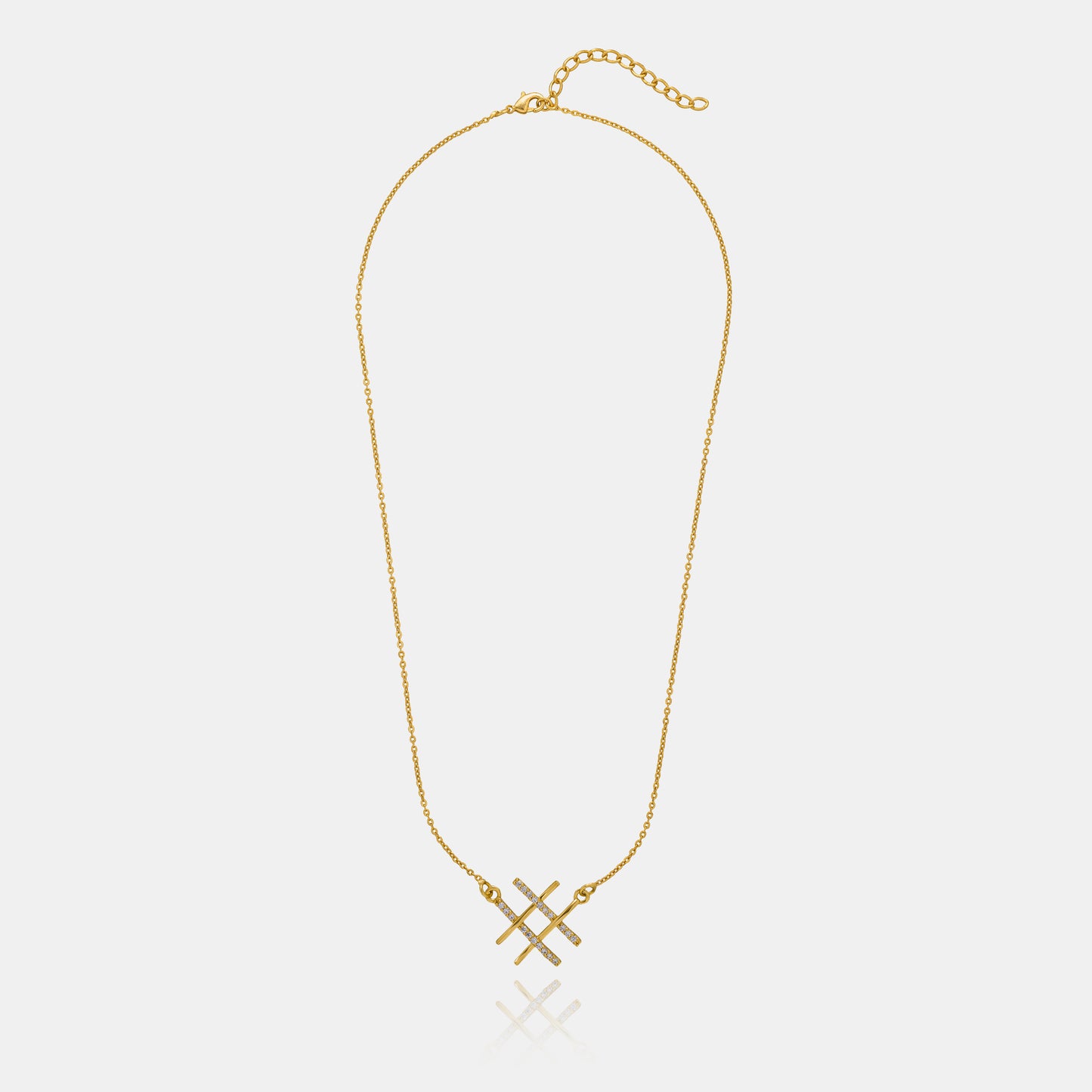 golden necklace with two crossed crosses on it