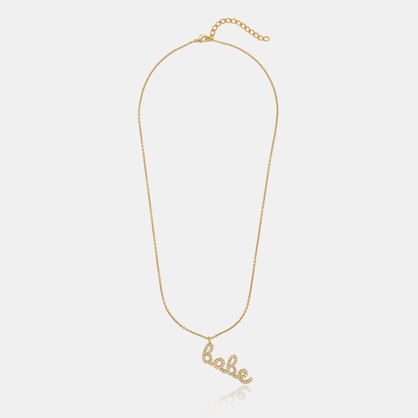 golden necklace with the word love on it