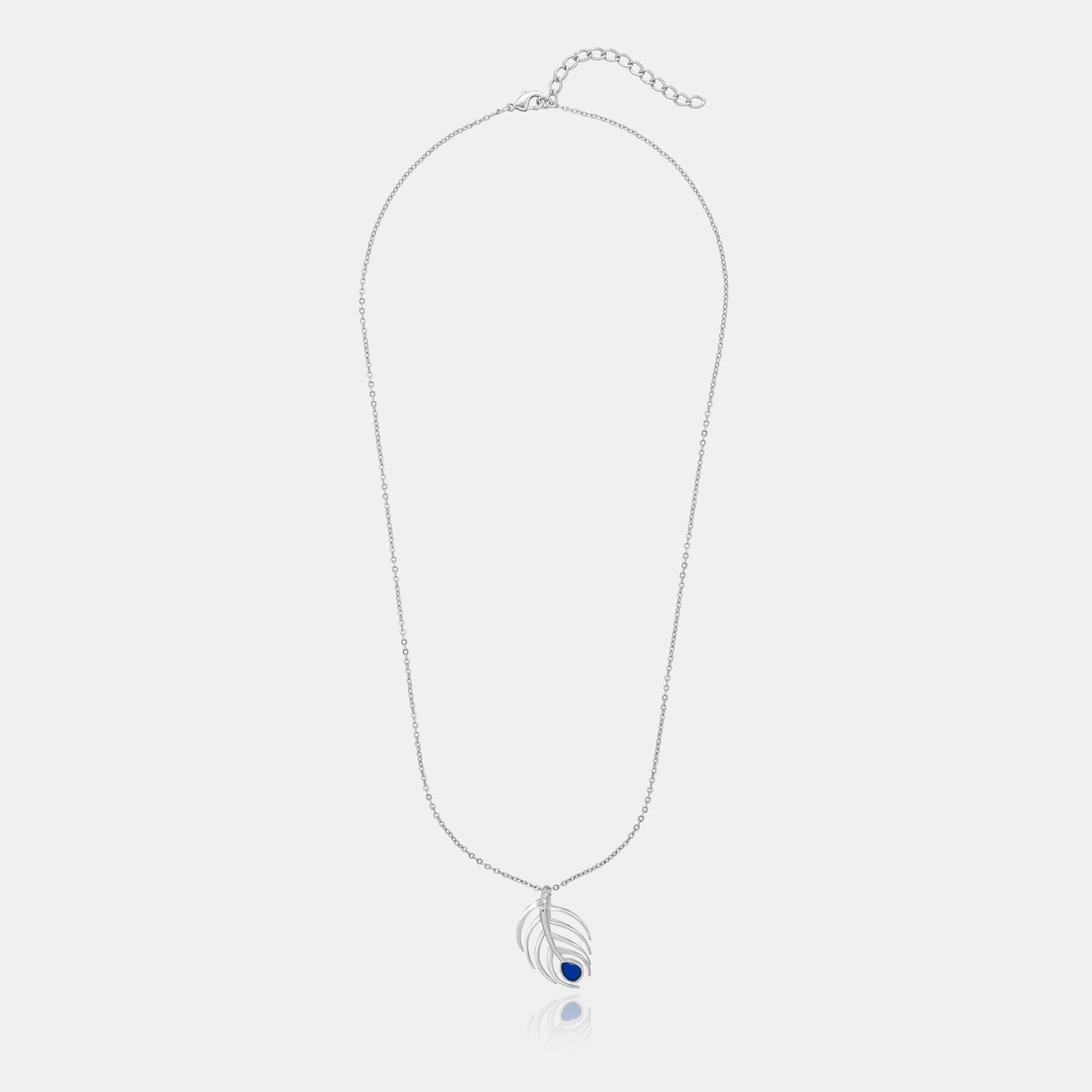 silver necklace with a blue stone