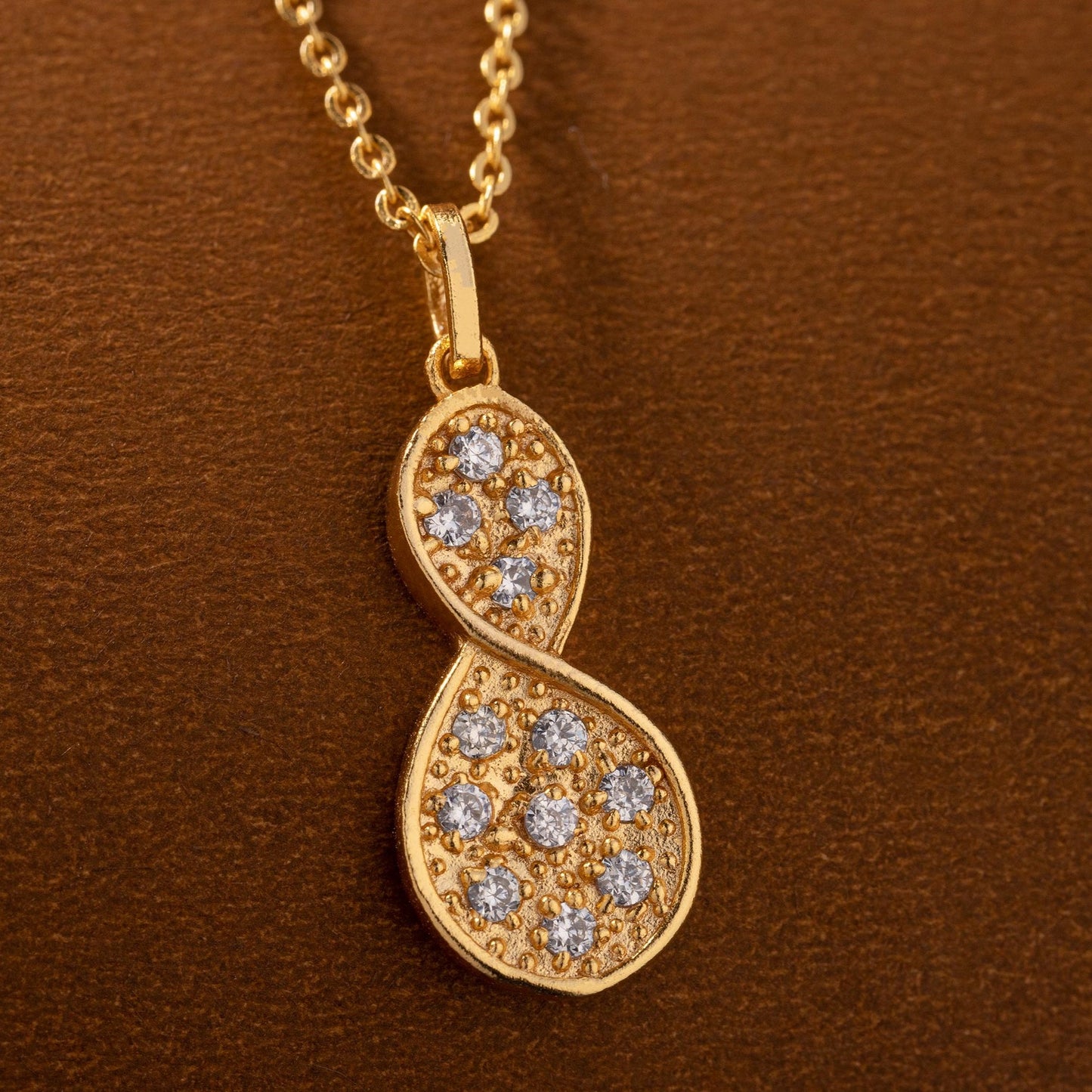 golden necklace with a diamond tear