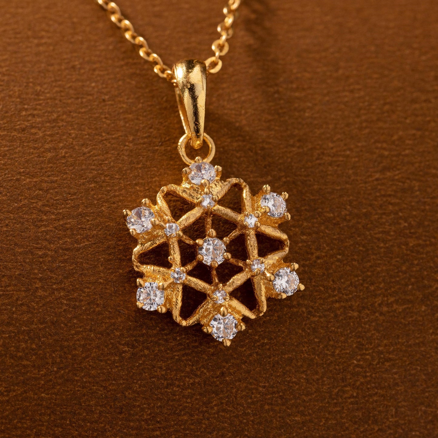 golden necklace with a diamond pendant