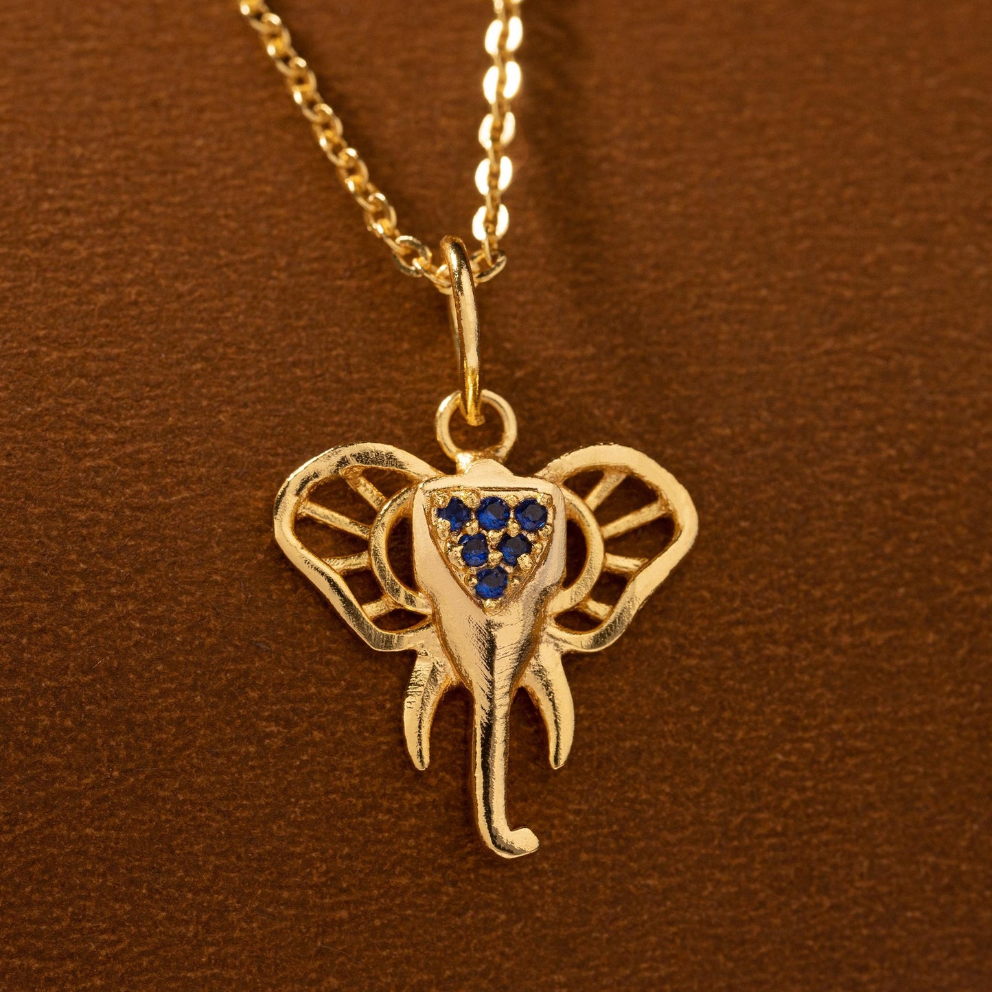 golden elephant necklace with sapphire stones