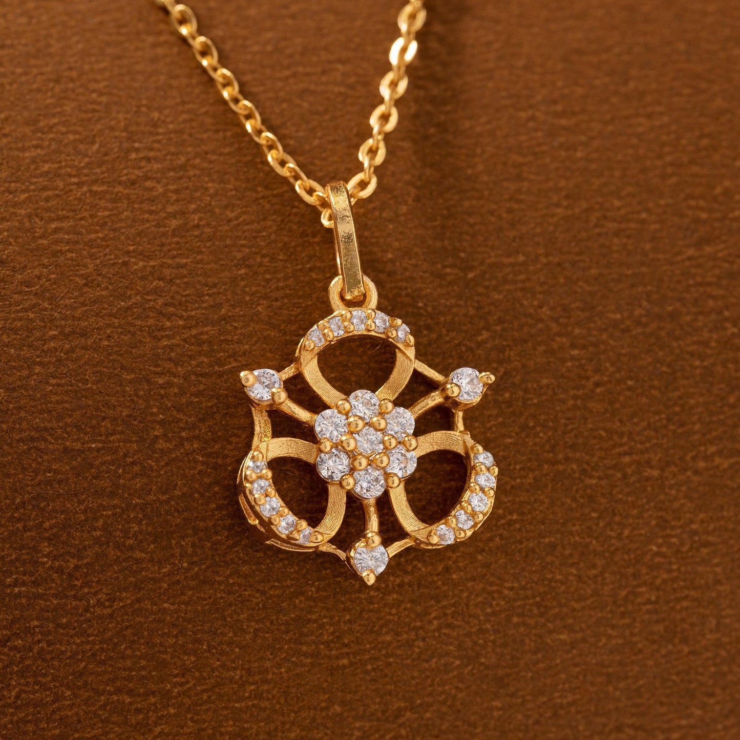 golden necklace with flower pendent