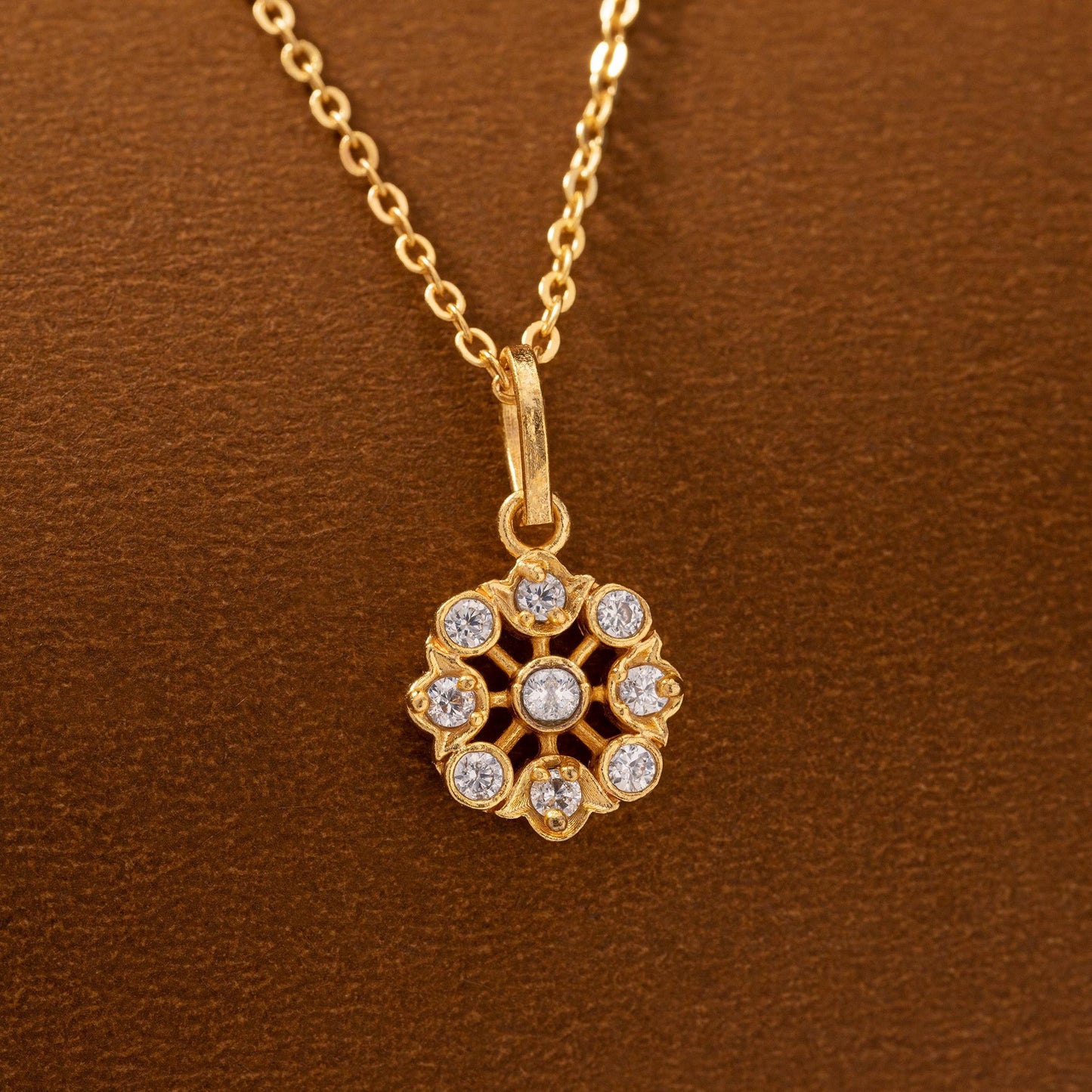 golden flower necklase with white stones