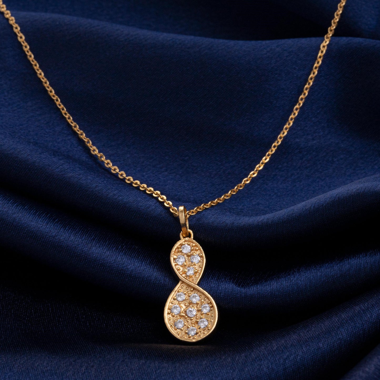 golden necklace with a diamond tear