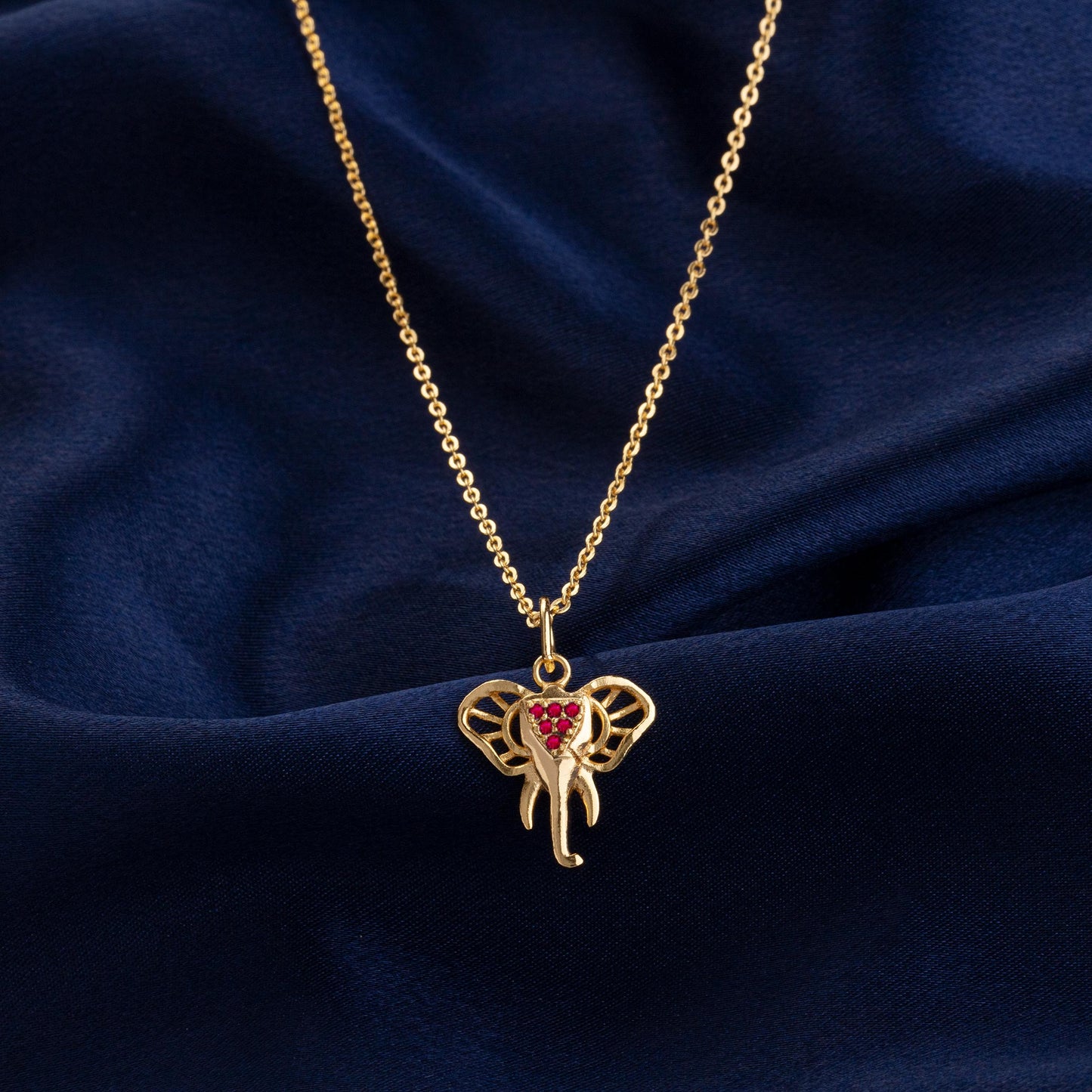 golden elephant necklace with sapphire stones