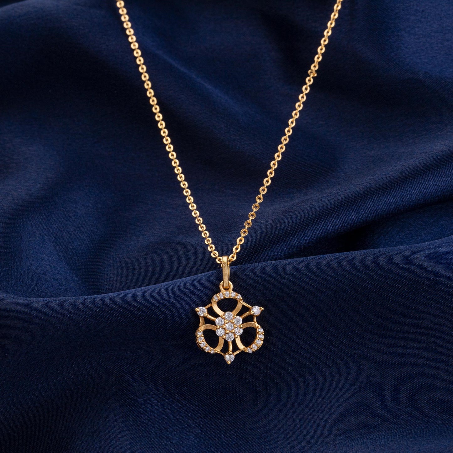 golden necklace with flower pendent