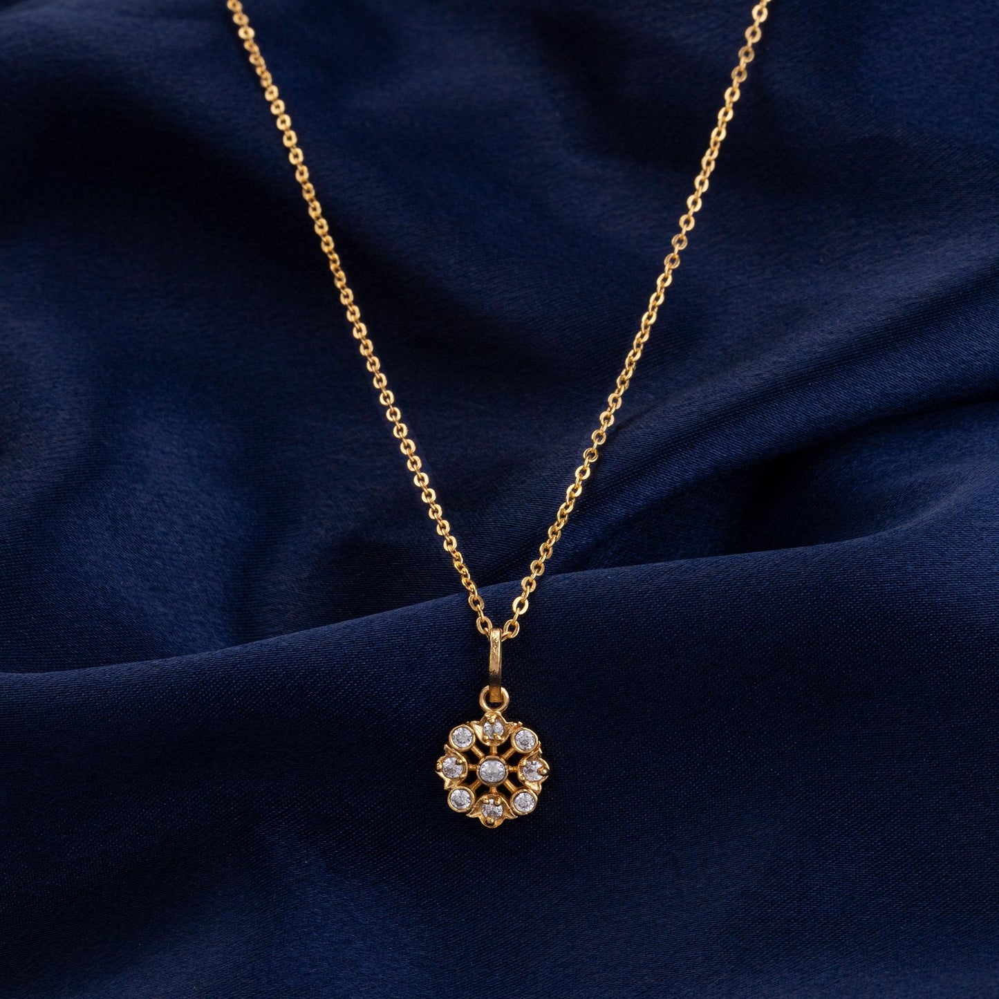 golden flower necklase with white stones