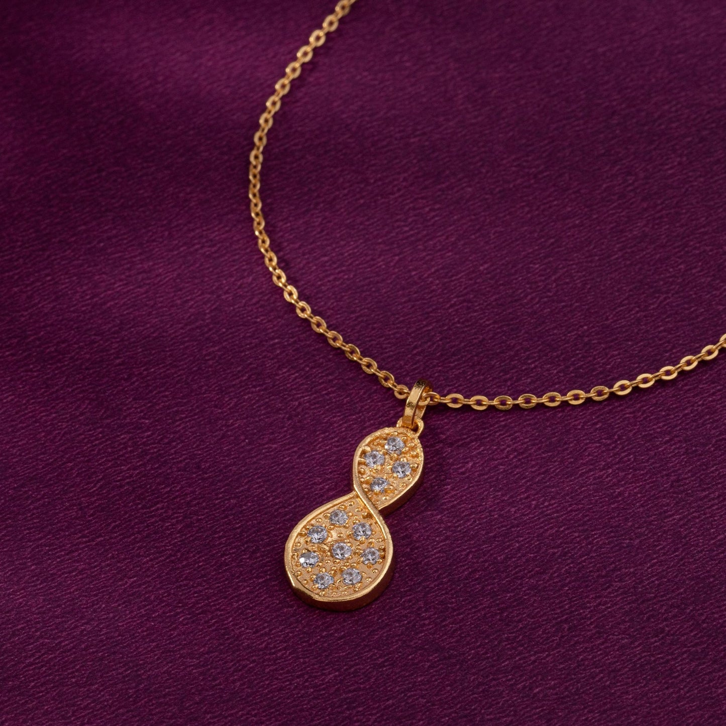 golden necklace with a diamond tear