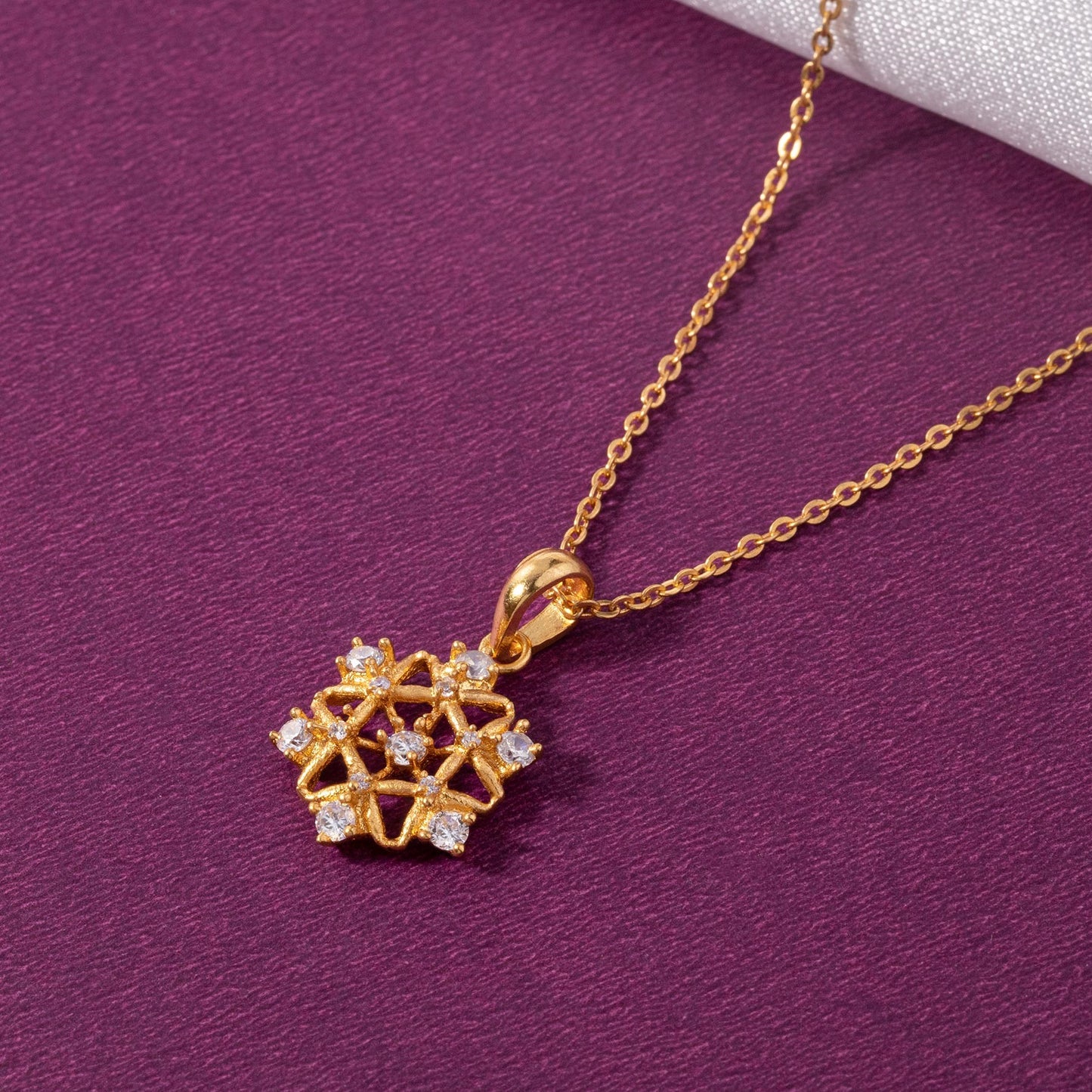 golden necklace with a diamond pendant