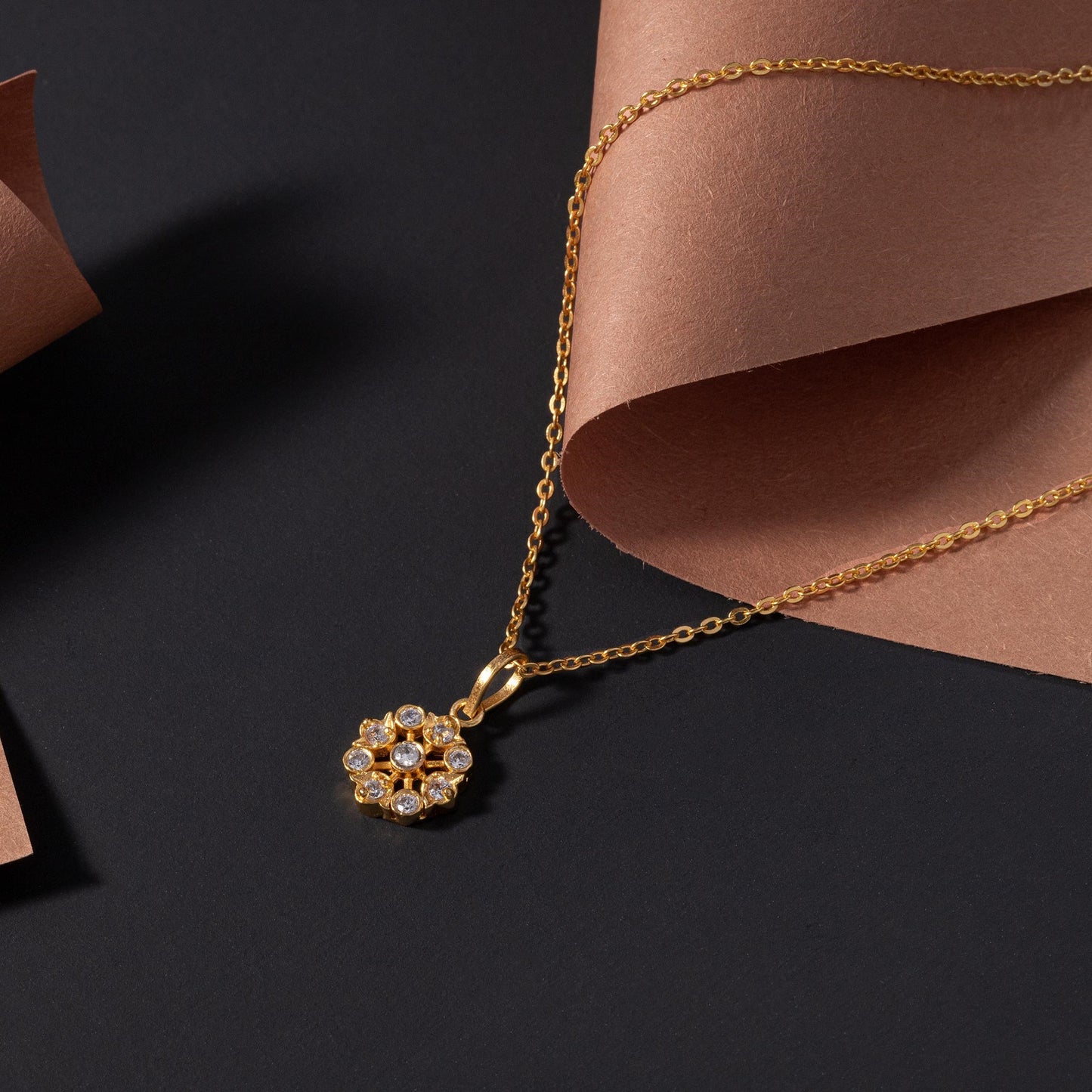 golden necklace with a flower design