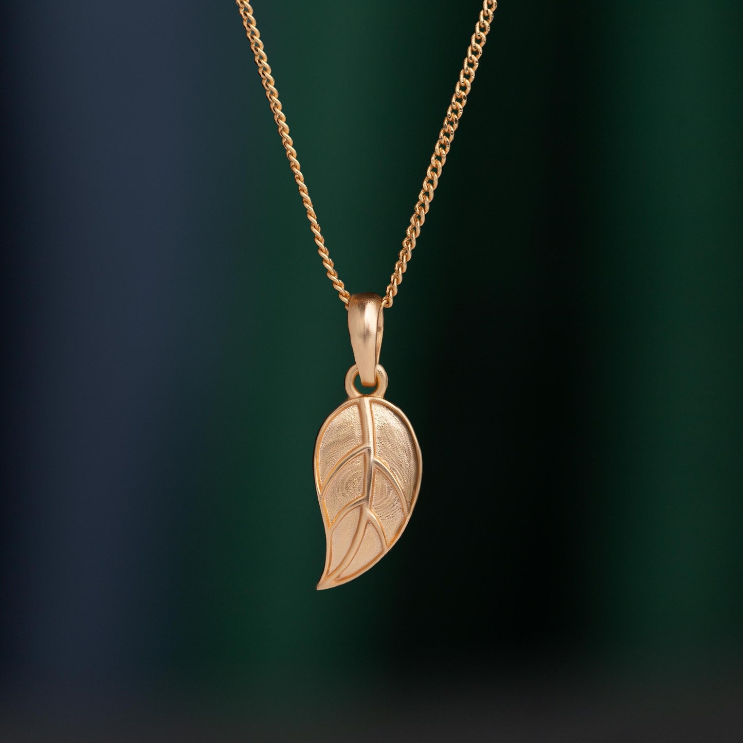 golden necklace with leaf pendant