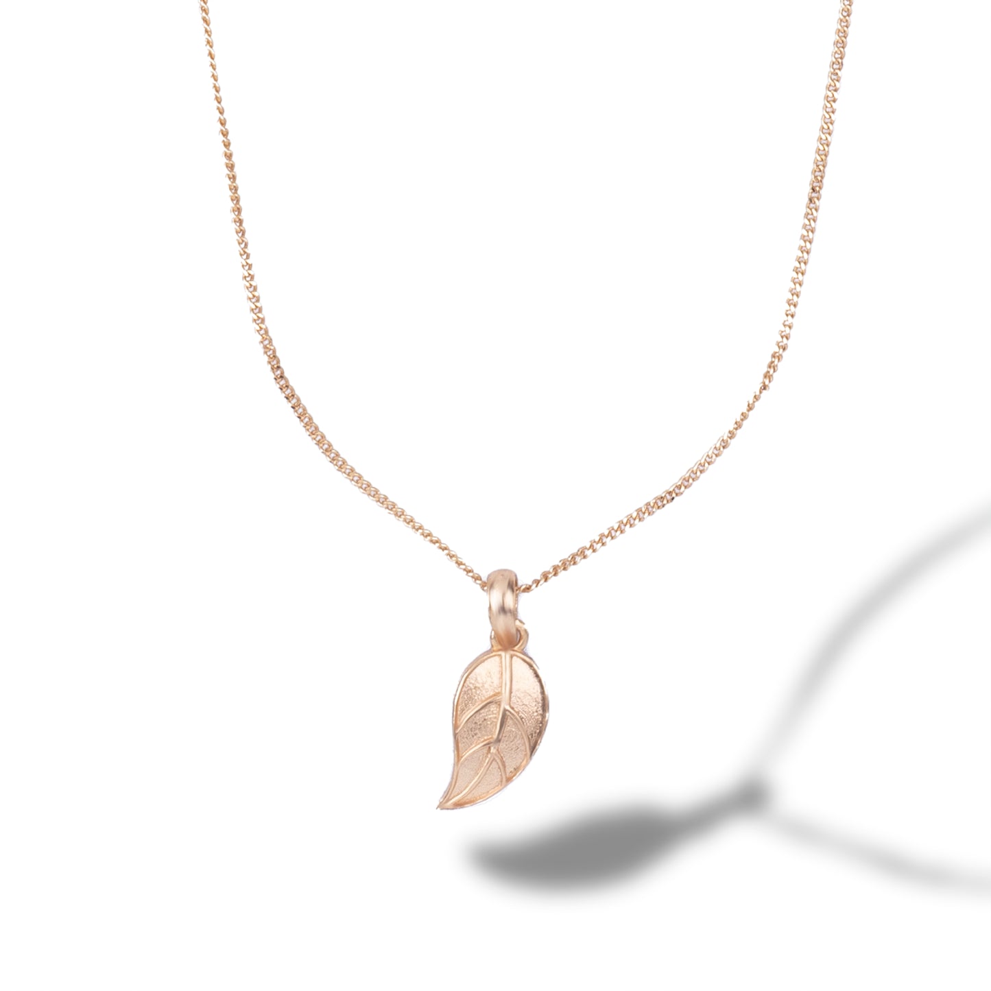 golden necklace with leaf pendant