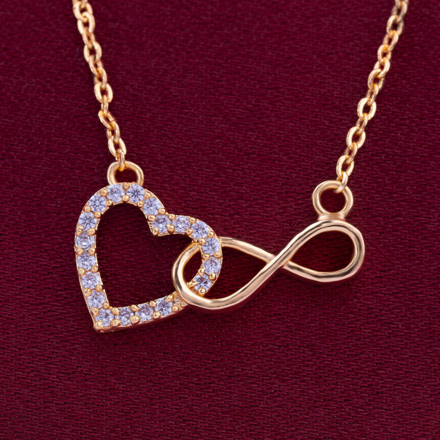 golden necklace with heart and infinity