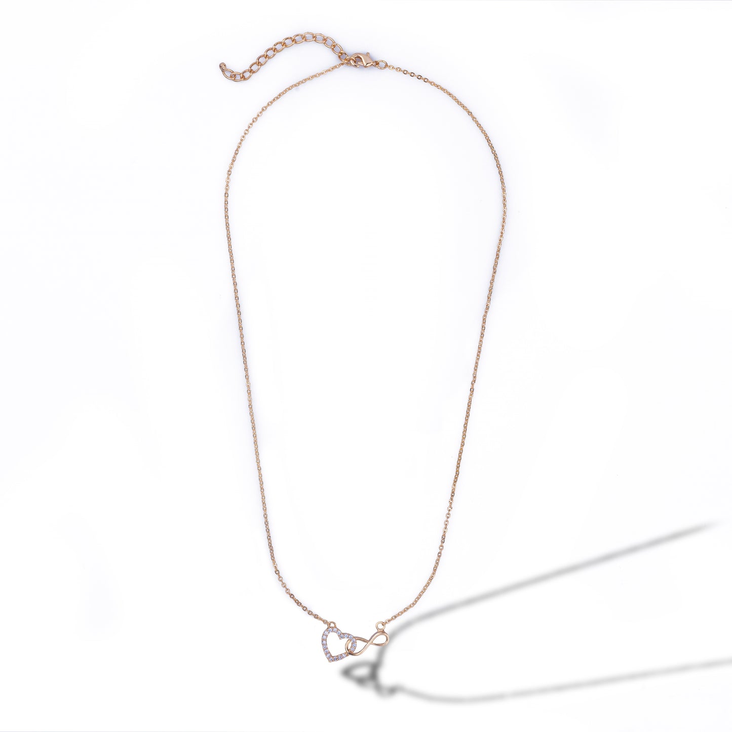 golden necklace with heart and infinity