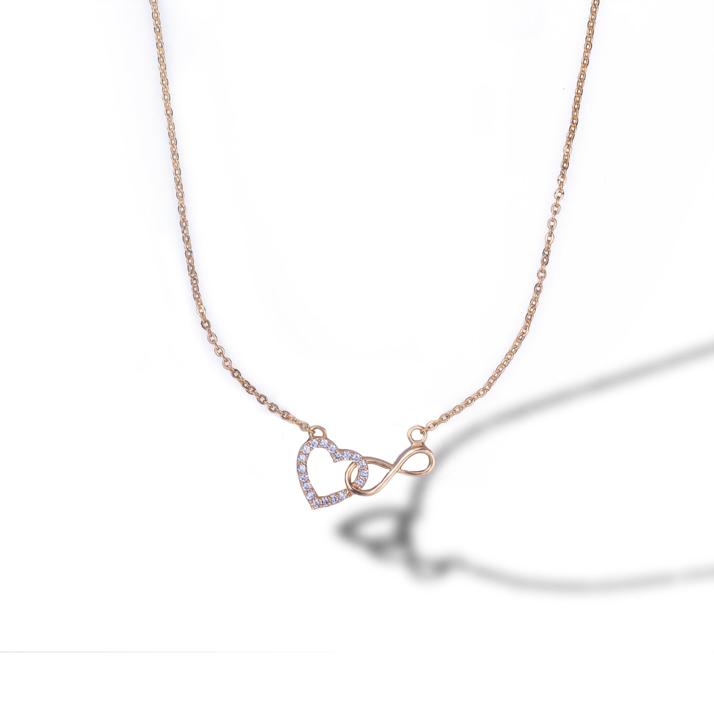 golden necklace with heart and infinity