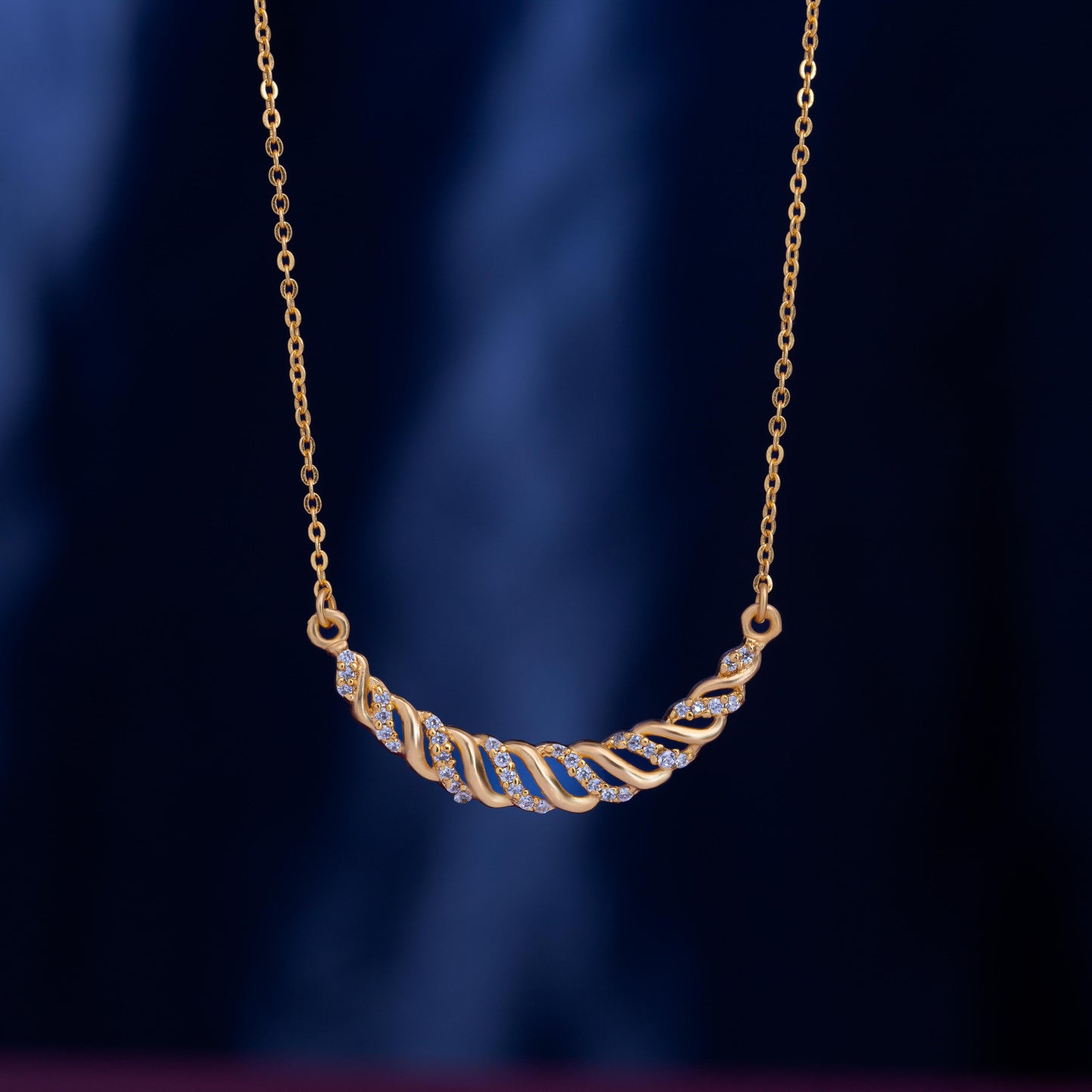 golden necklace with sapphire stones