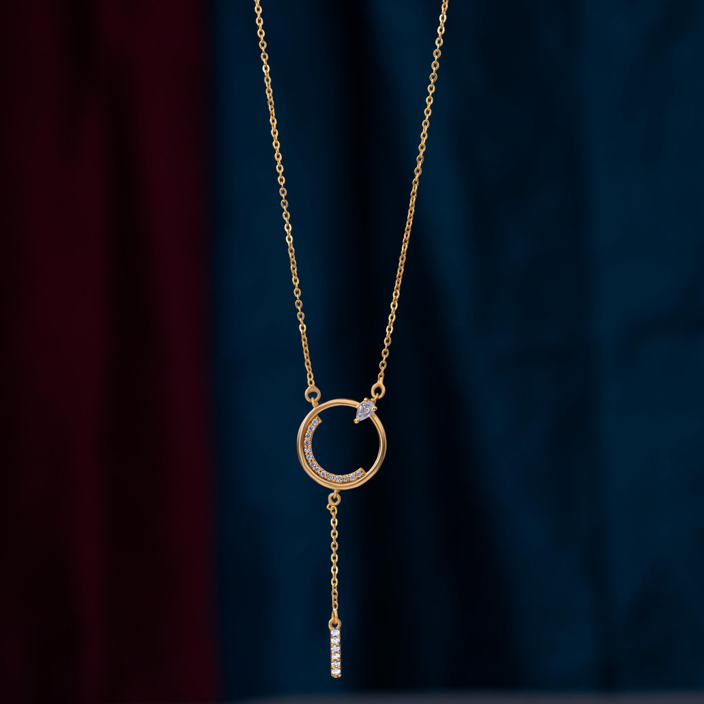 golden necklace with a diamond circle