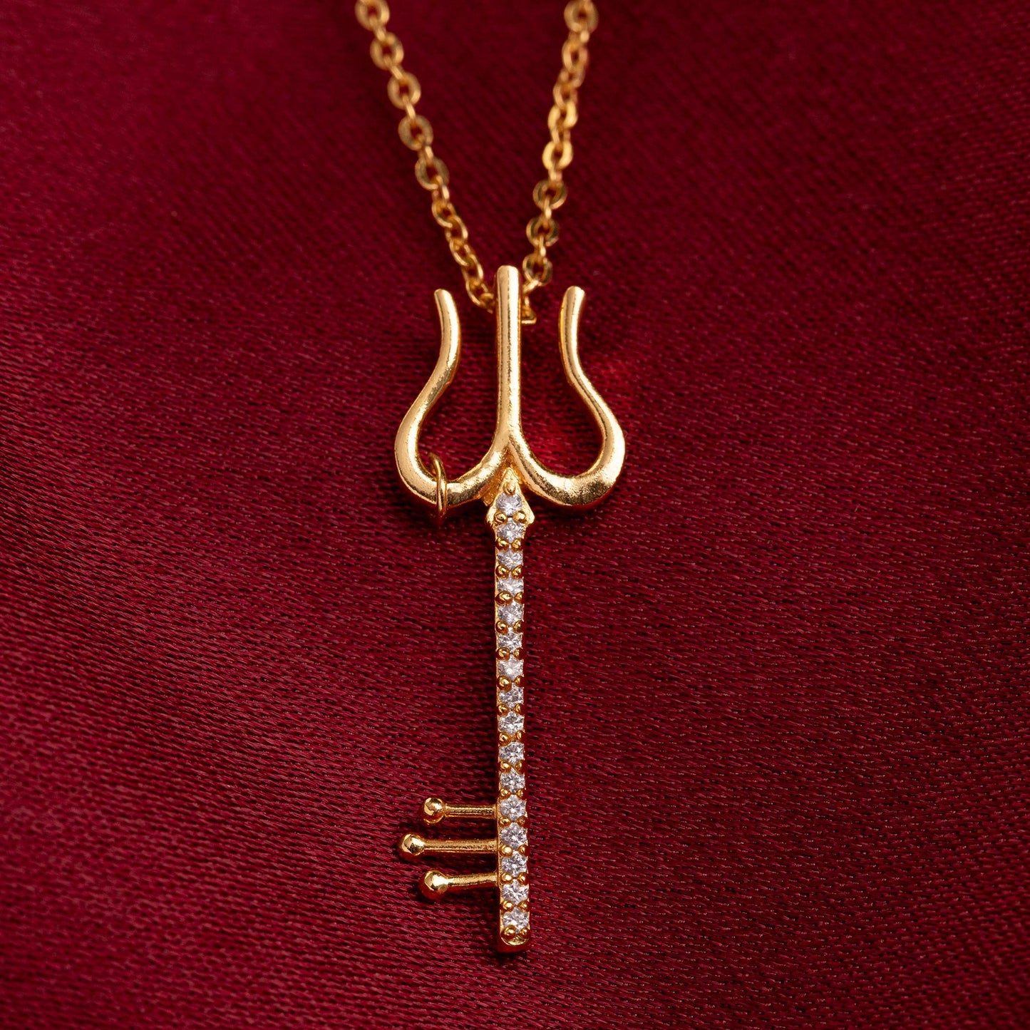 golden necklace with a diamond pendant