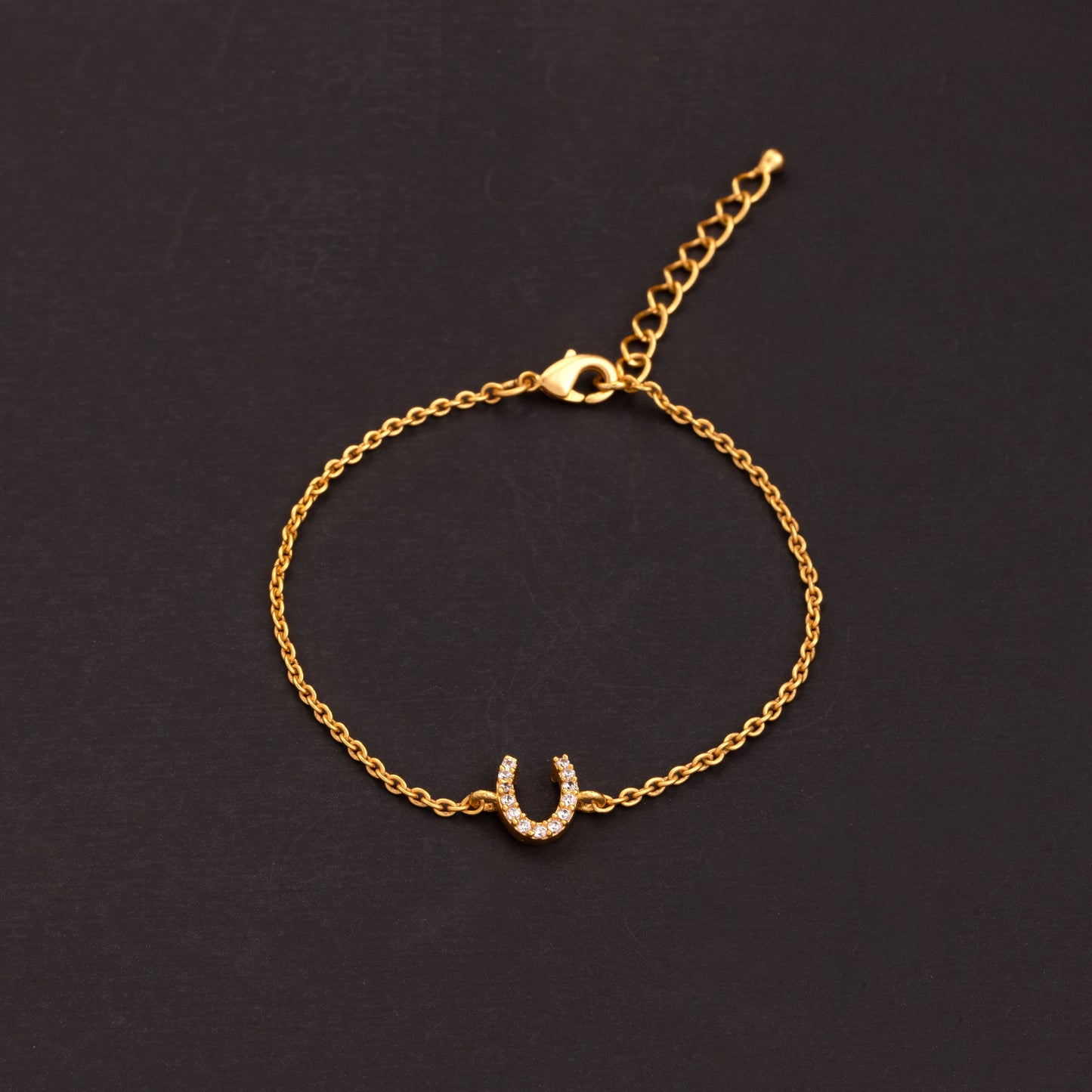 golden bracelet with c cut small diamonds