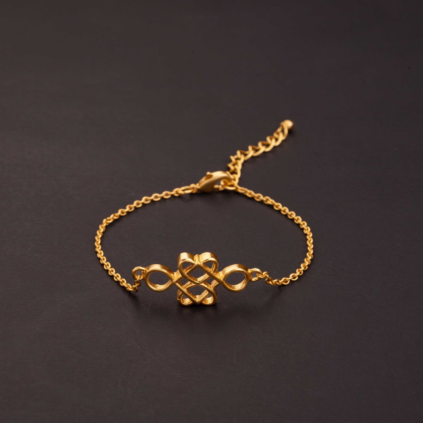 golden bracelet with a beautiful knot