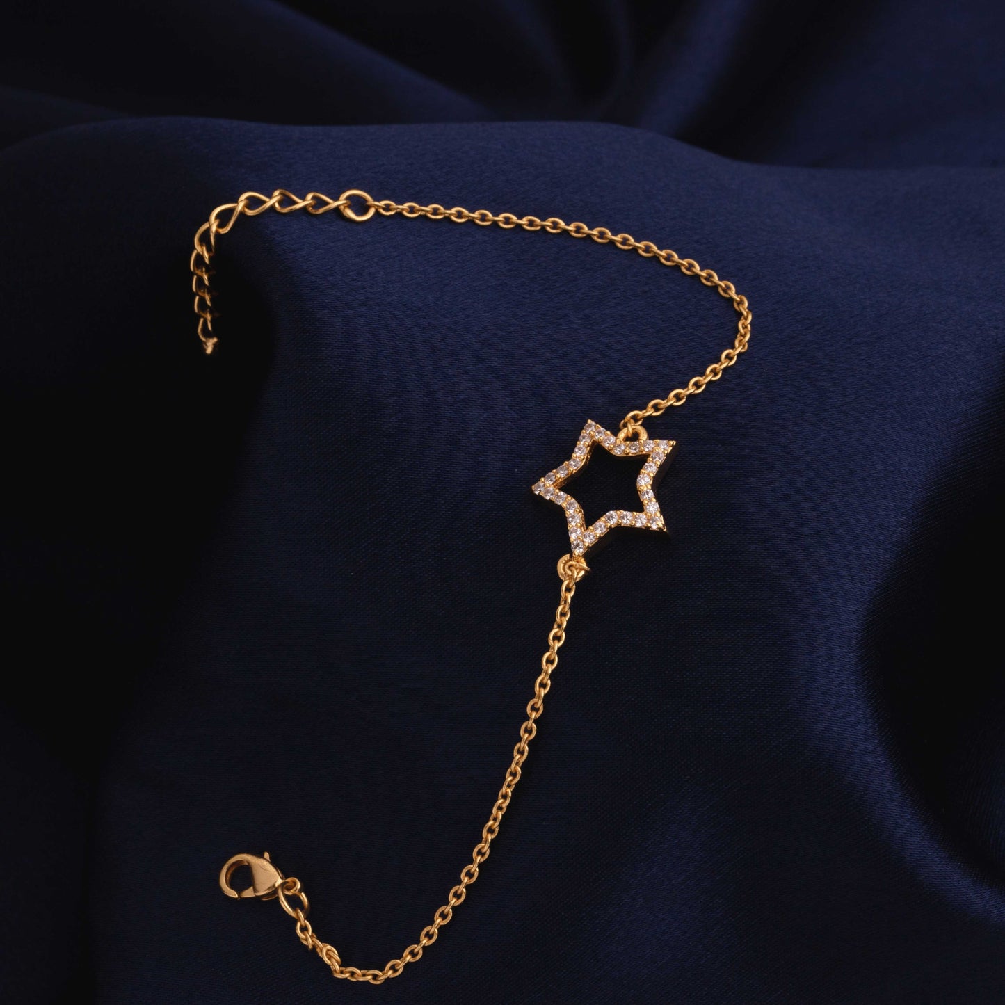 golden bracelet with a star charm