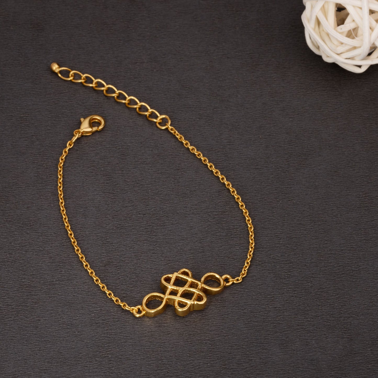 golden bracelet with a beautiful knot