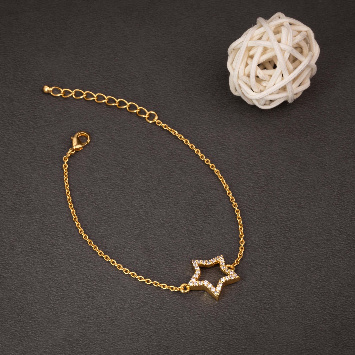 golden bracelet with a star charm