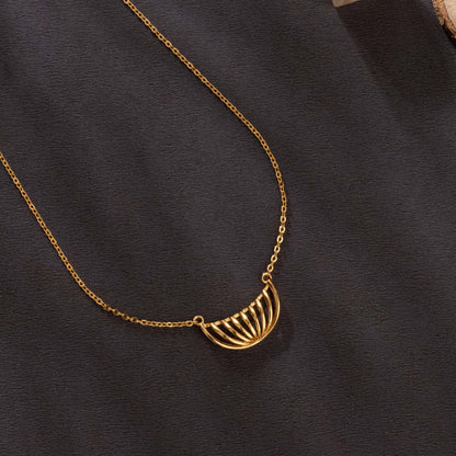 Golden Necklace with a Large Curved Design