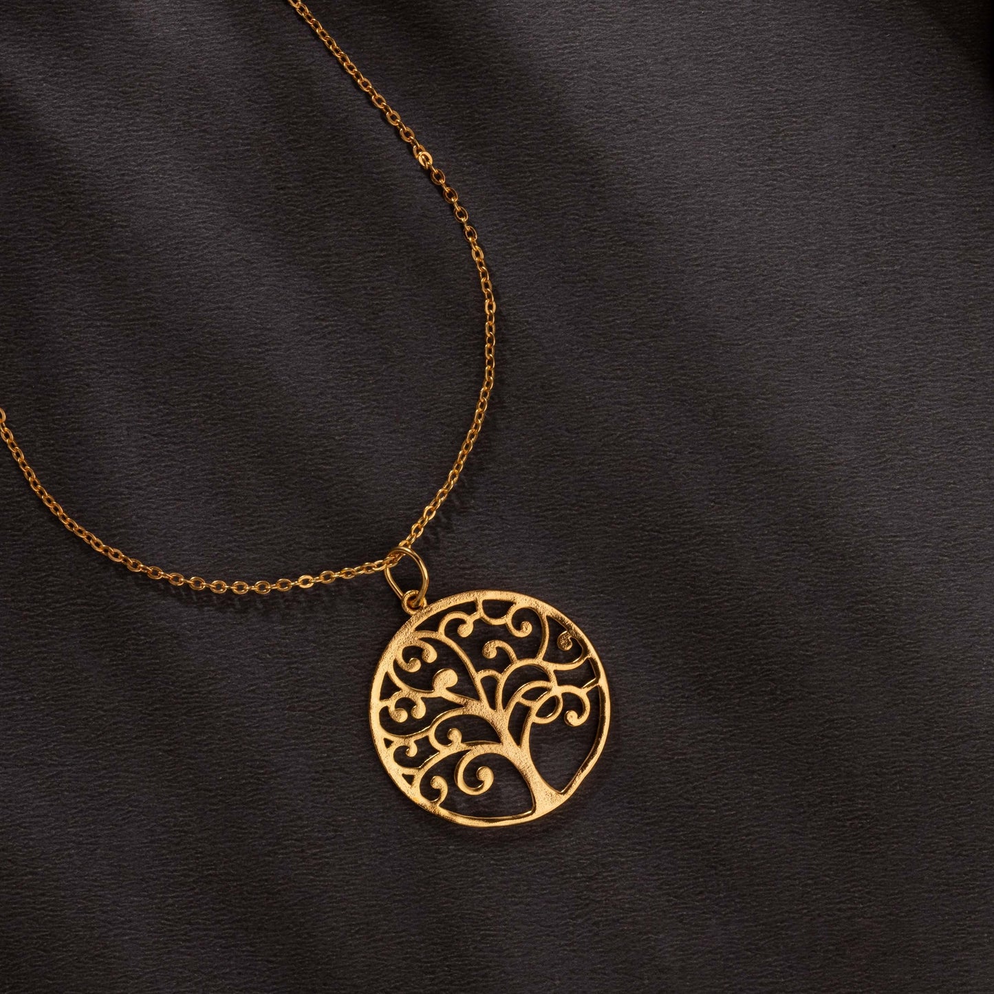 golden necklace with tree of life pendant