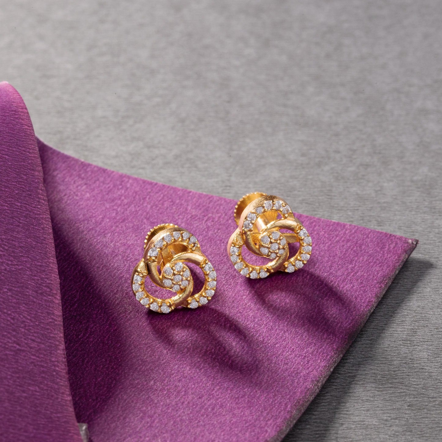 pair of golden and diamond earrings