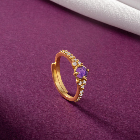 Golden Ring with a Purple Stone and Diamonds