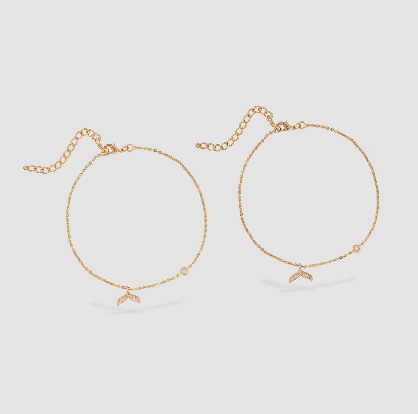 pair of golden anklets with stone