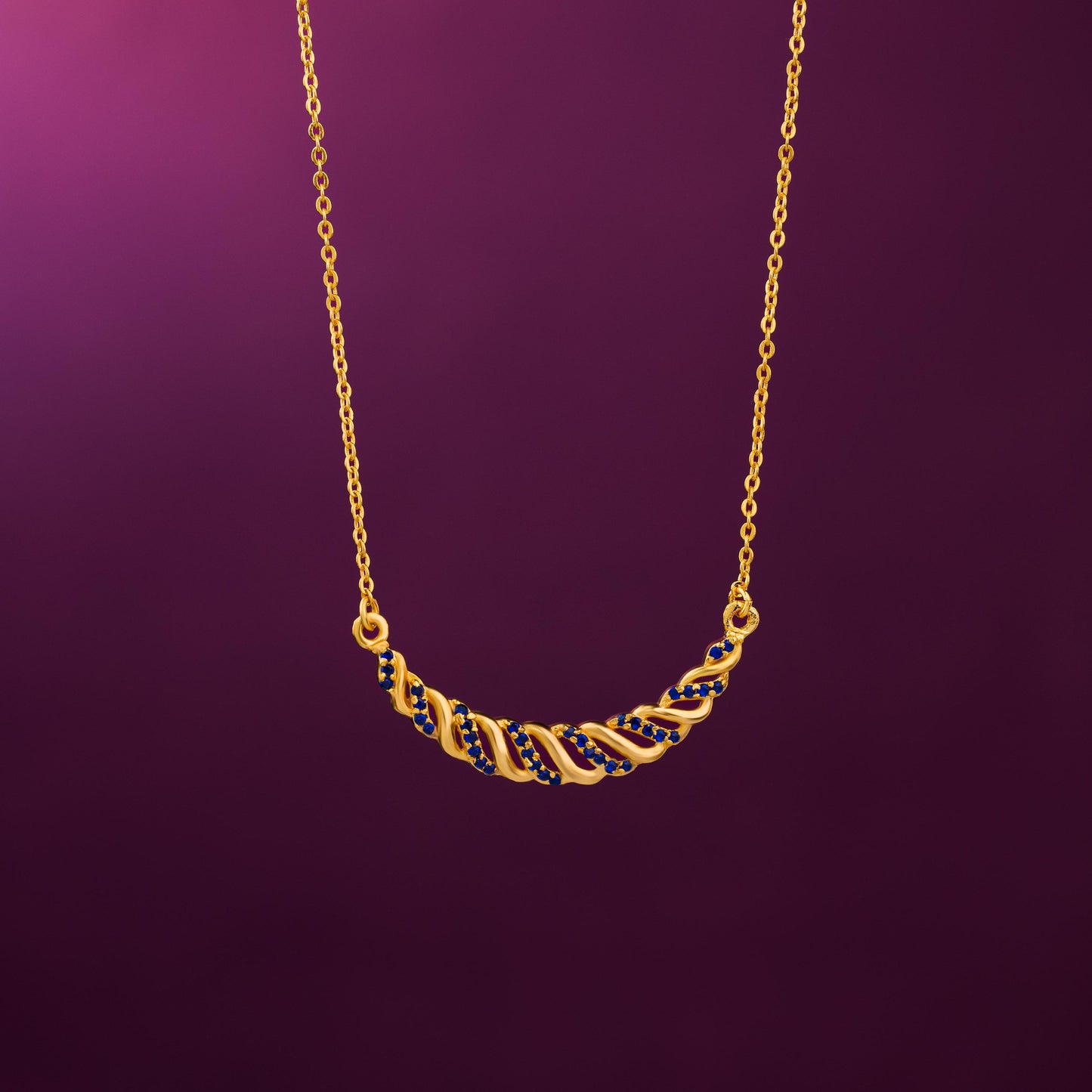 golden necklace with sapphire stones