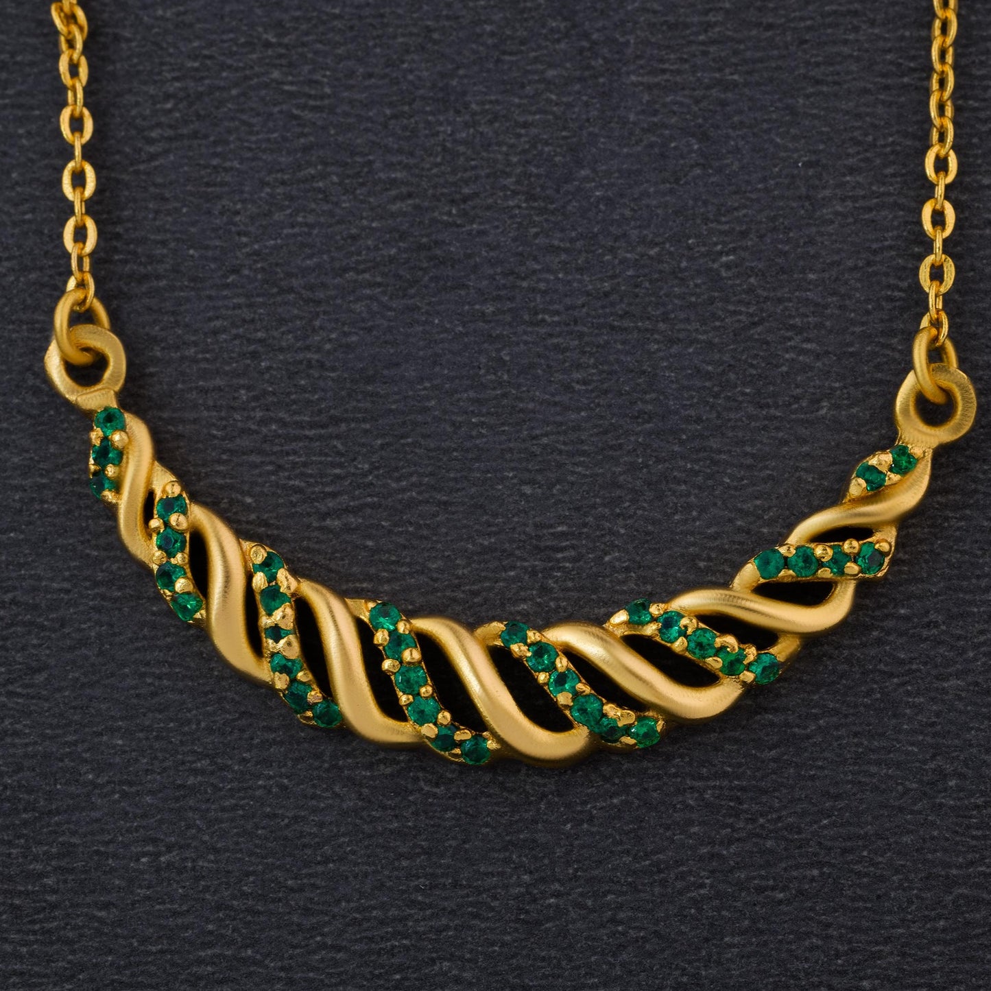 golden necklace with sapphire stones