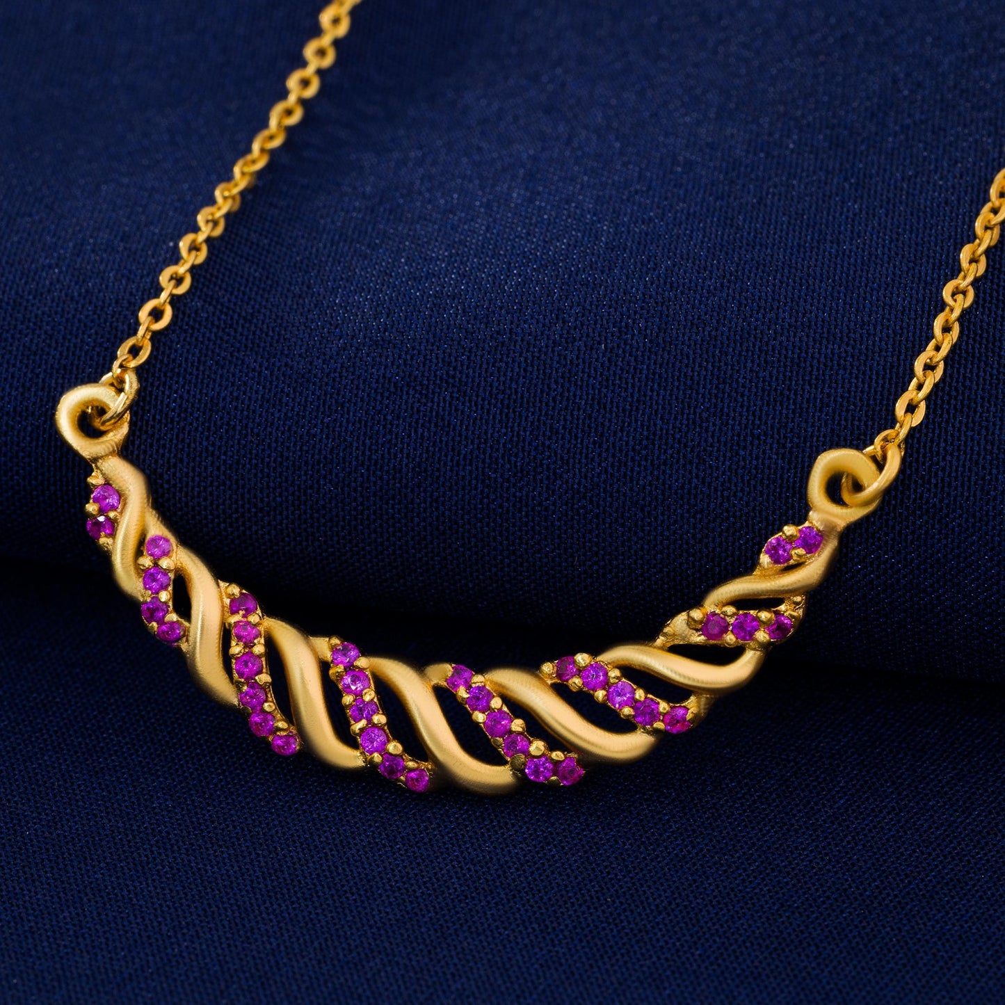 golden necklace with sapphire stones