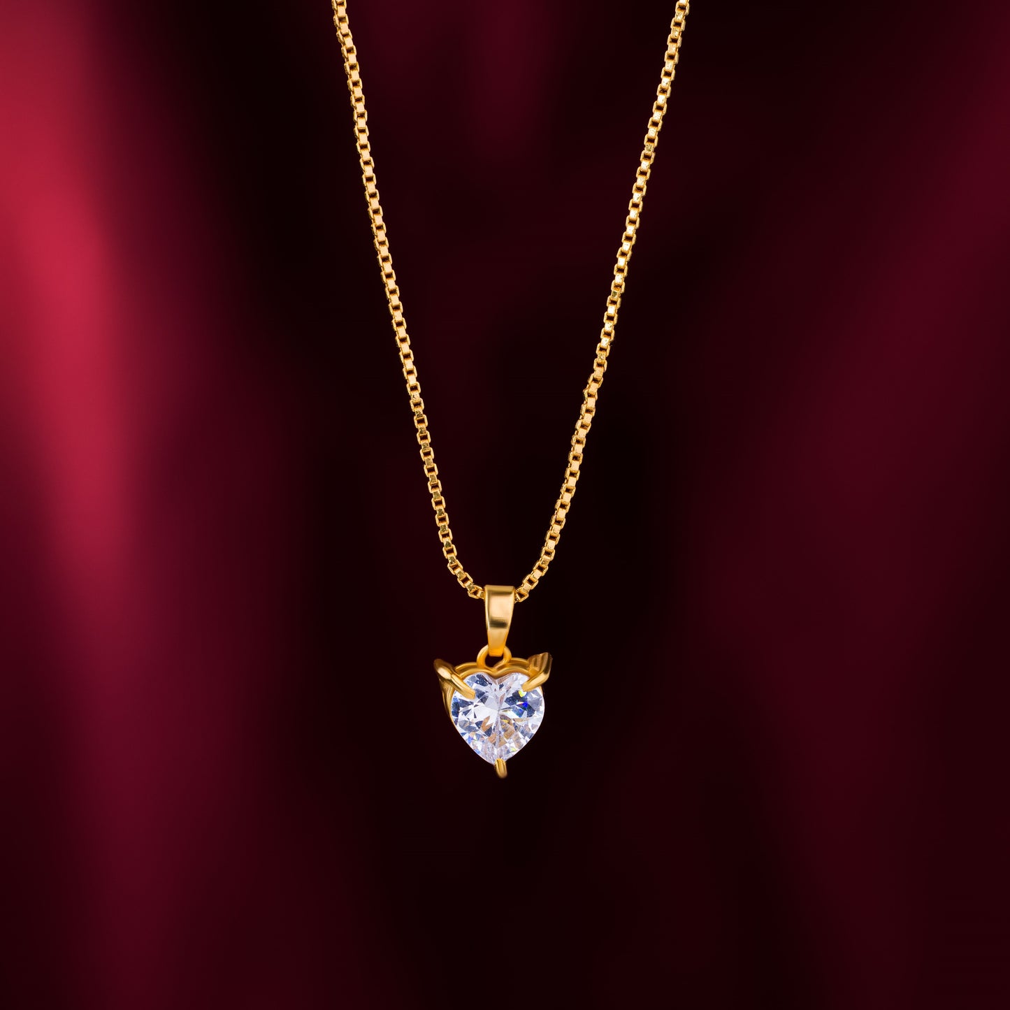 golden necklace with white heart pendant