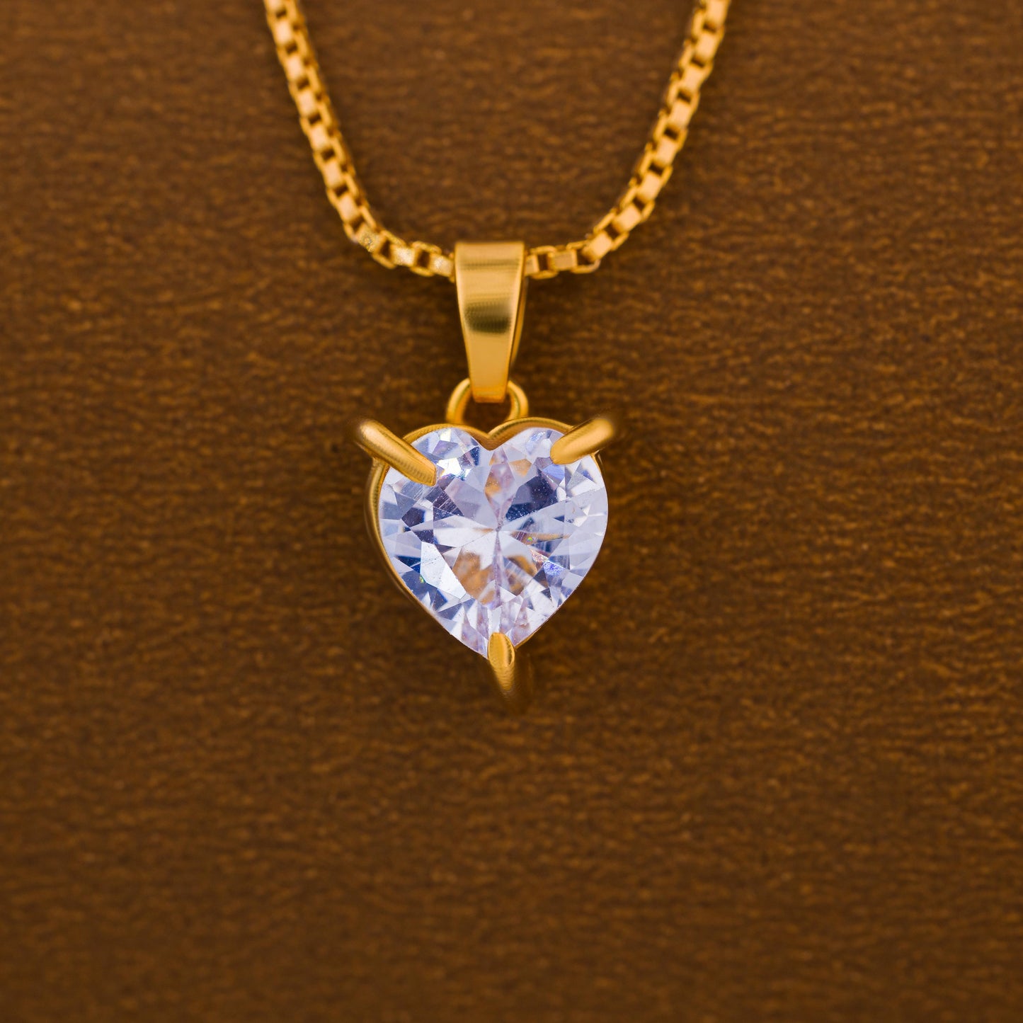 golden necklace with white heart pendant