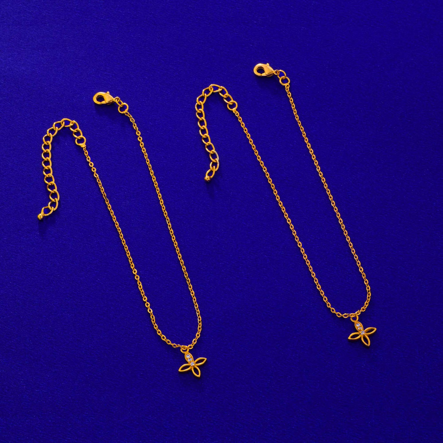 pair of golden anklets with diamonds