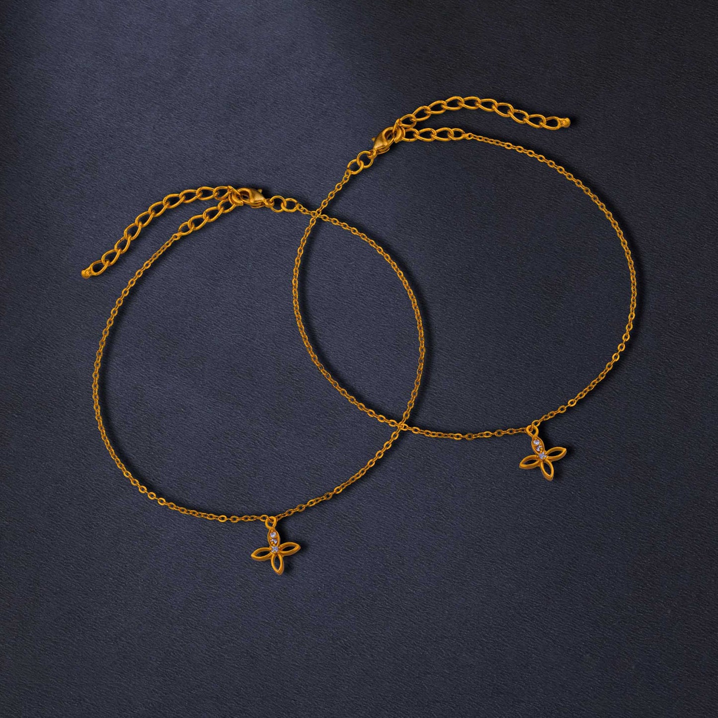 pair of golden anklets with diamonds