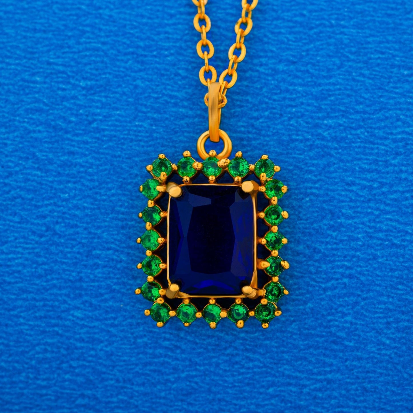 golden necklace with a two color stone