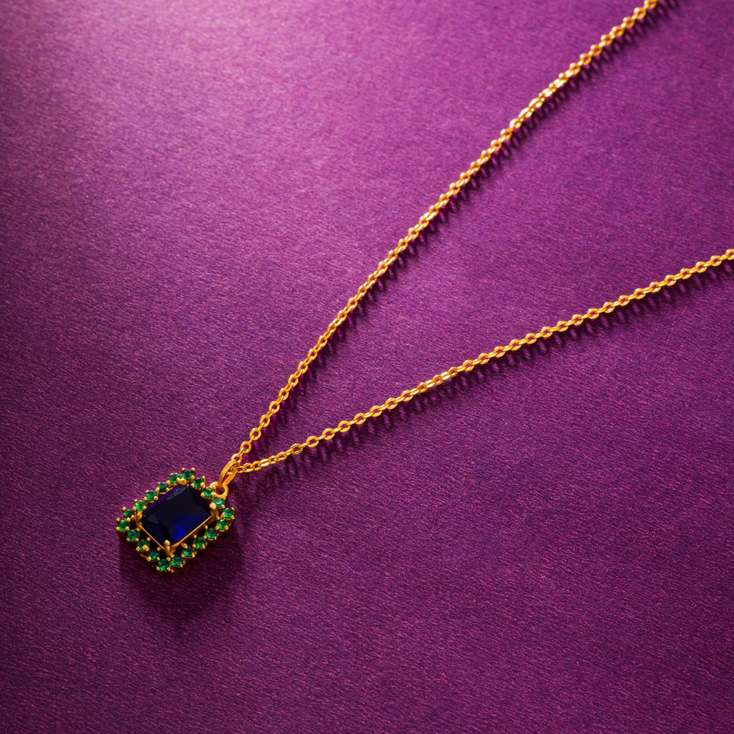 golden necklace with a two color stone