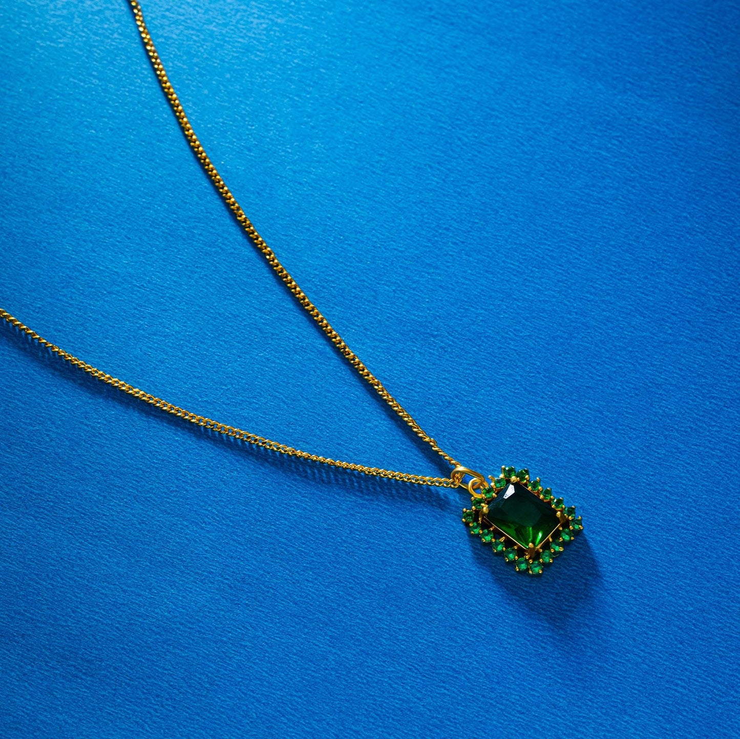 golden necklace with a two color stone