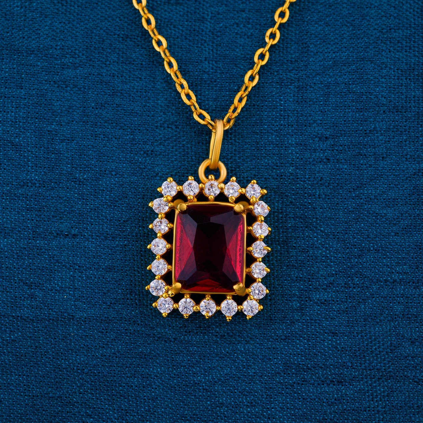 golden necklace with a two color stone