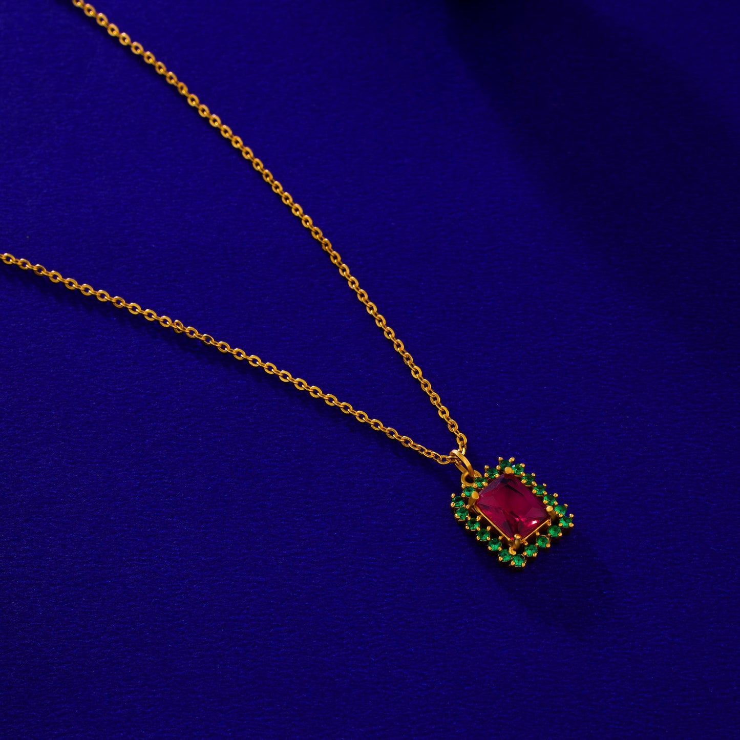 golden necklace with a two color stone