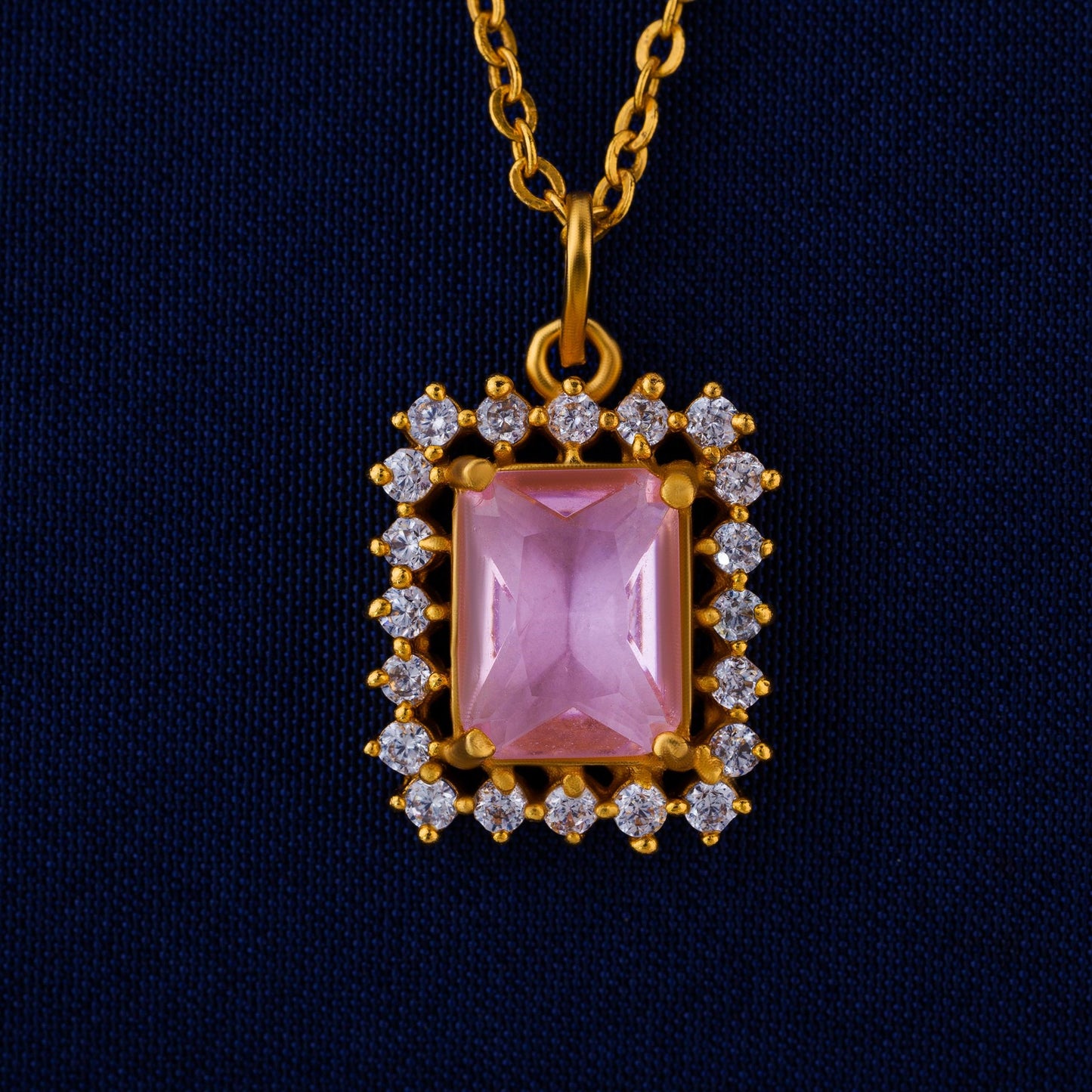 golden necklace with a two color stone