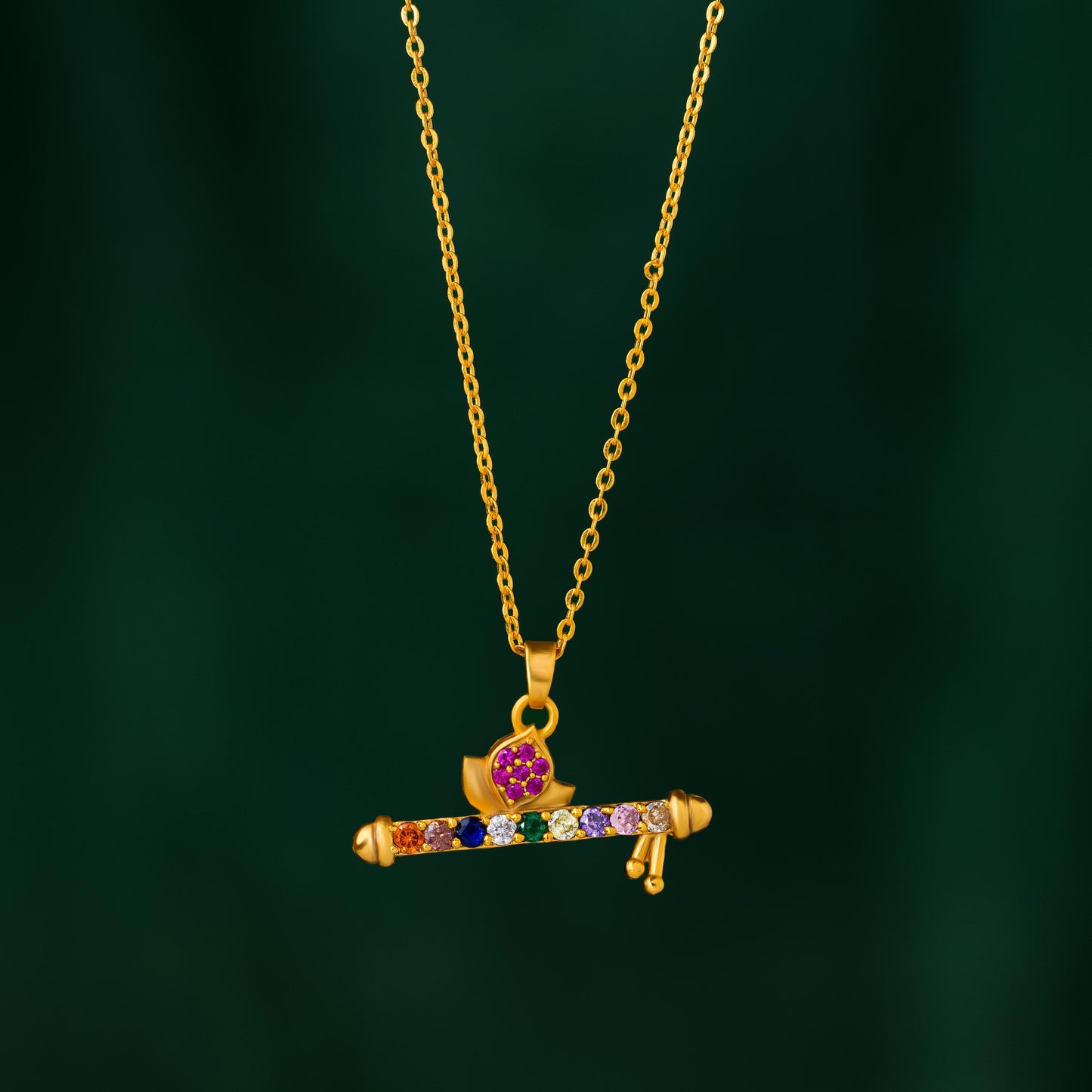 golden necklace with a flute pendants